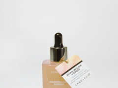 Perfume oil dropper bottle with product sleeve and gold dropper cap