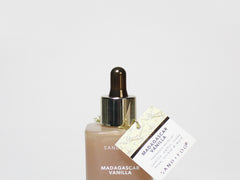 Sand + Fog Madagascar Vanilla perfume oil bottle with dropper and box label