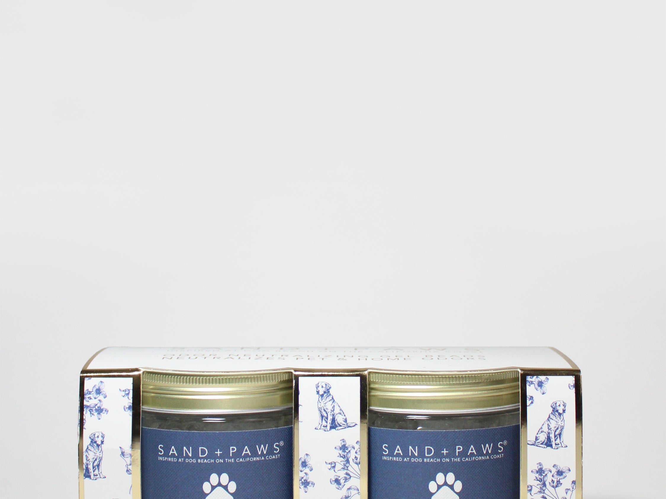 Set of two Sand + Paws gel scent beads tins with paw-print labels
