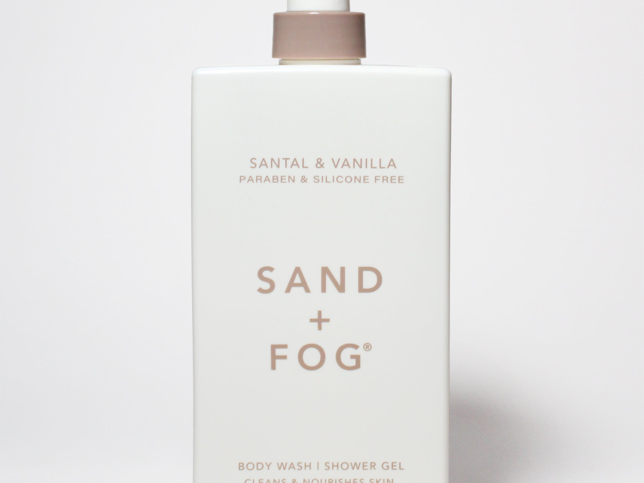Santal & Vanilla body wash bottle with pump, Sand + Fog label, 32 oz