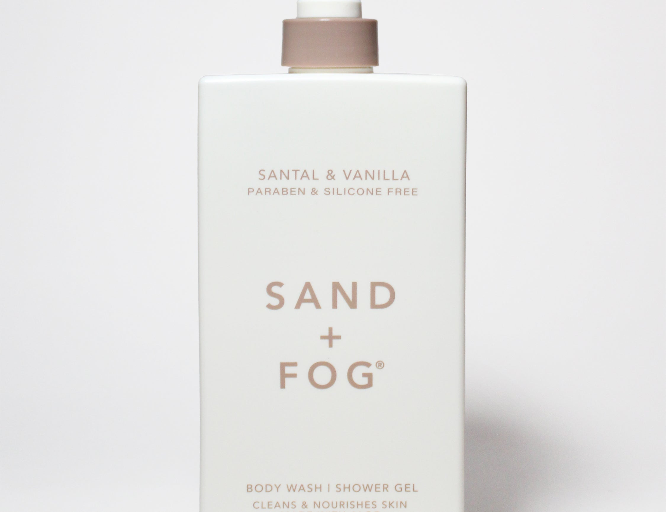 Santal & Vanilla body wash bottle with pump, Sand + Fog label, 32 oz