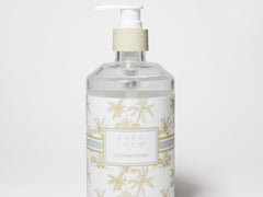 Liquid hand soap bottle with white pump, clear bottle and gold palm label