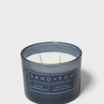 12 oz scented candle in dark blue glass jar with two wicks, Sand + Fog label