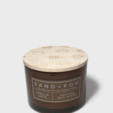 12 oz scented candle in dark brown glass jar with patterned light wax lid