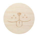 Light wood candle lid with engraved icon for Sand + Paws teakwood candle