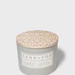 SAND + FOG candle jar with beige patterned wax top and Natural Wax label