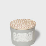 SAND + FOG candle jar with beige patterned wax top and Natural Wax label