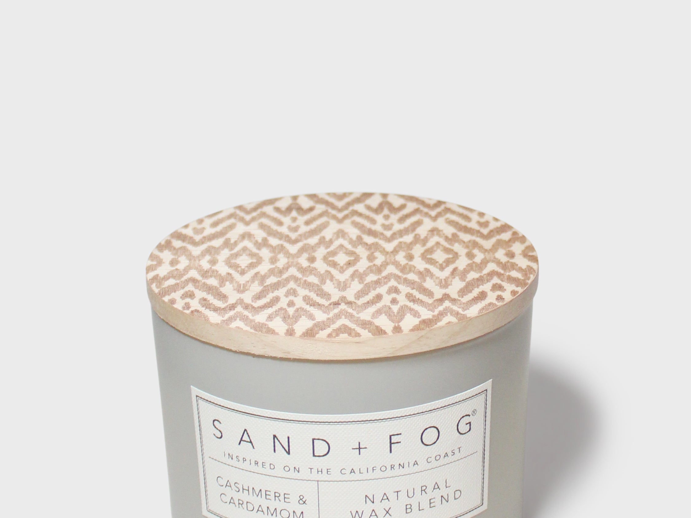 SAND + FOG candle jar with beige patterned wax top and Natural Wax label