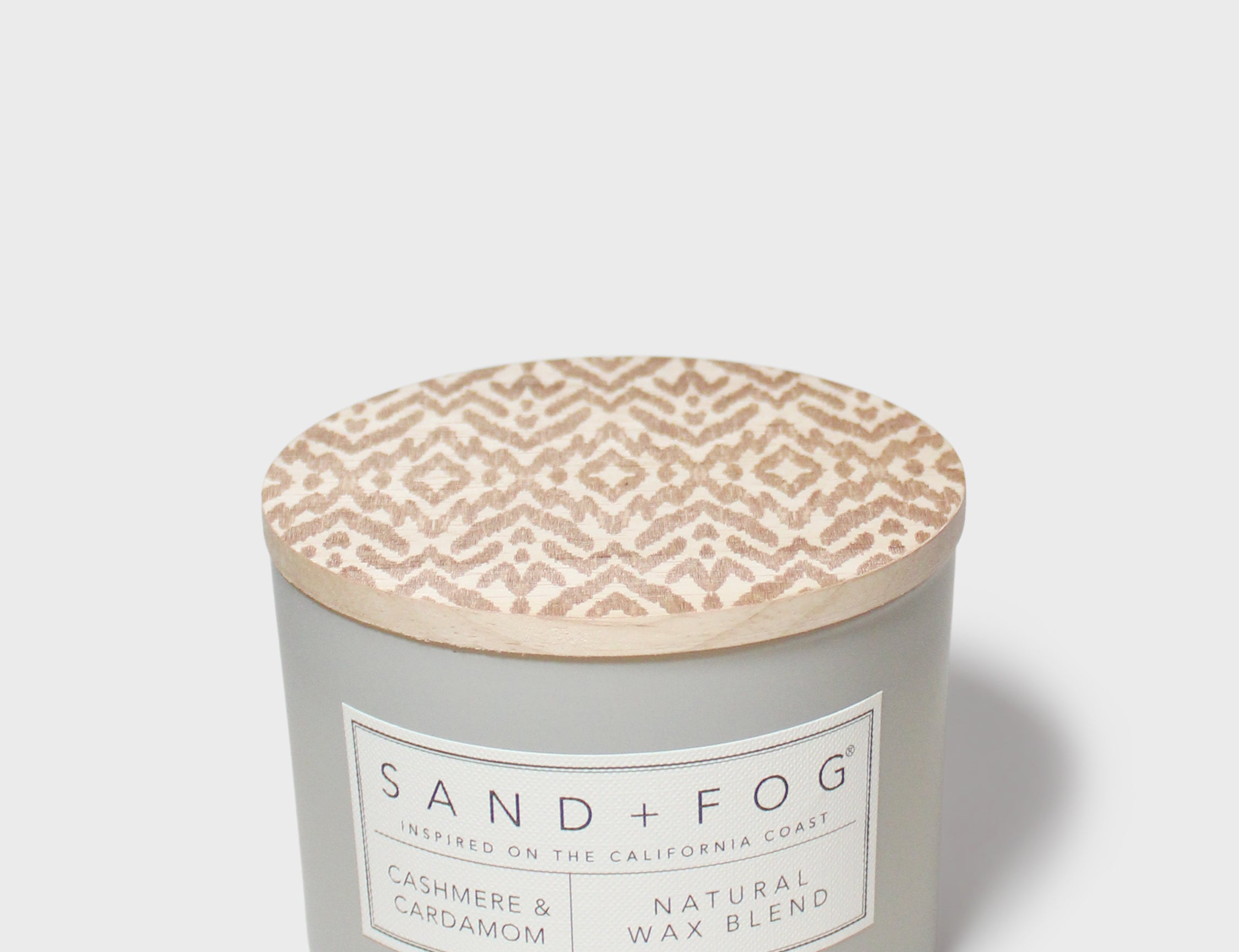 SAND + FOG candle jar with beige patterned wax top and Natural Wax label