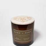 Amber scented candle with wooden lid and Sand + Paws paw-print design