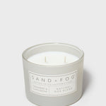 SAND + FOG scented candle in glass jar with cream wax and two wicks