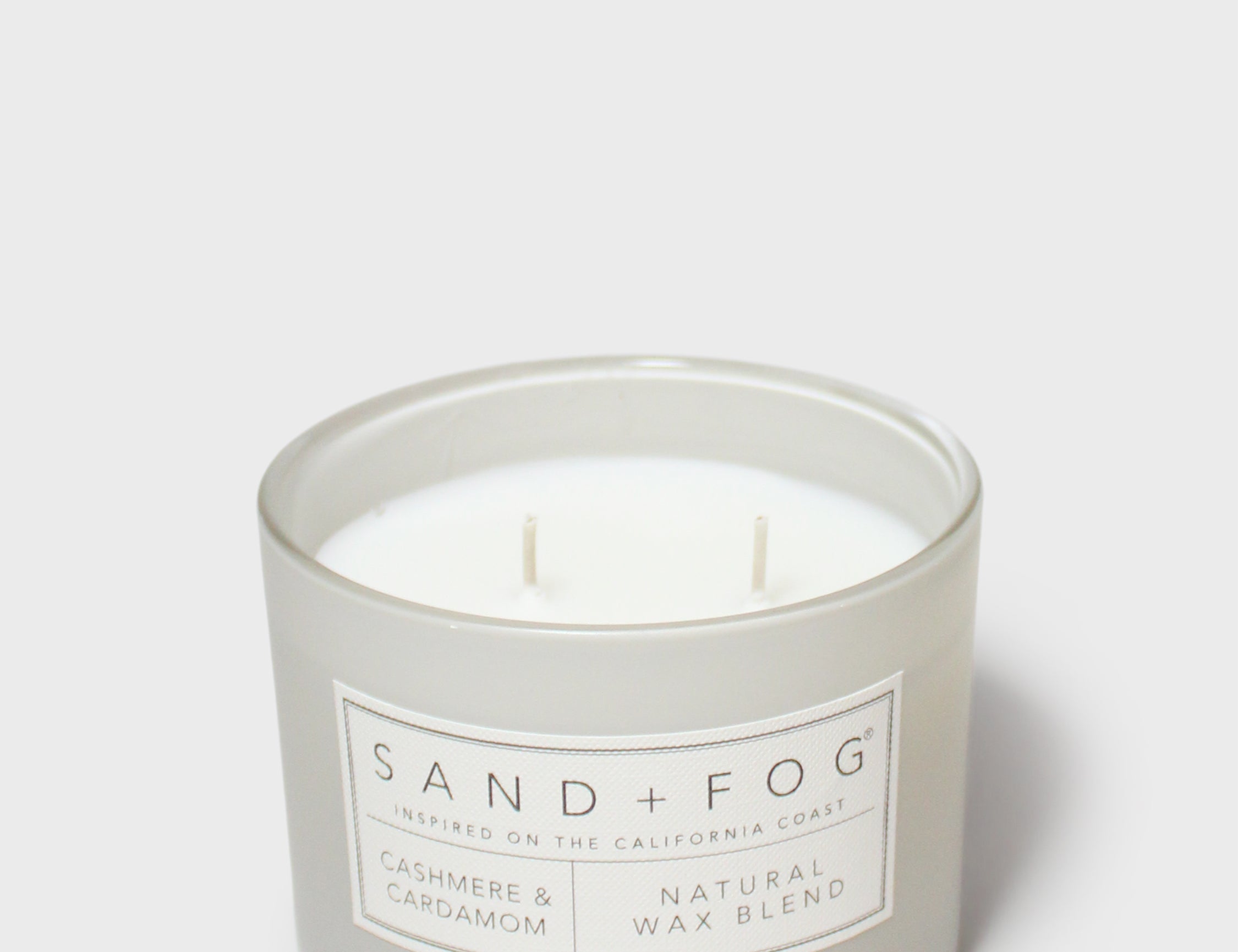 SAND + FOG scented candle in glass jar with cream wax and two wicks