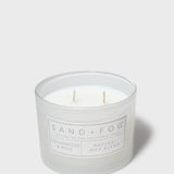 Sand + Fog scented candle jar with two wicks and Cedarwood & Rose label