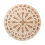 Sand + Fog scented candle lid with patterned circular design and plus symbol