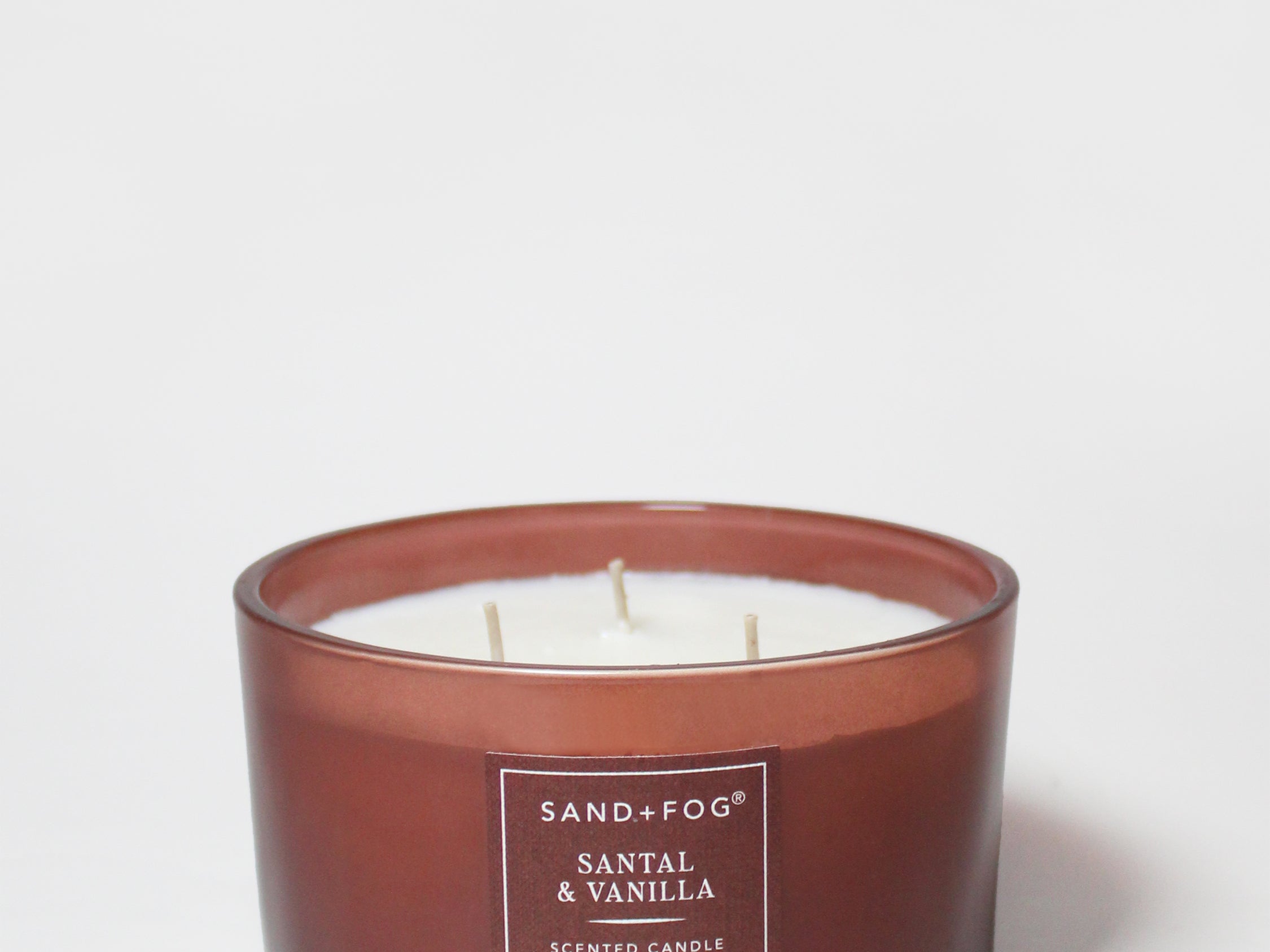Brown jar SAND+FOG candle with label, three wicks, 16 oz