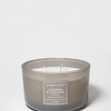 Sand+Fog scented candle in smoky gray glass jar with label and three wicks