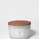 16 oz scented candle in white glass jar with wooden lid and Cedarwood & Rose label