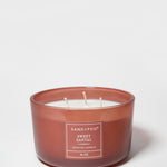Amber glass scented candle jar with two wicks and label, Sweet Santal, 16 oz