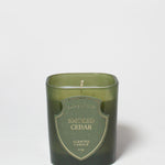 Smoked Cedar scented candle in a dark green glass vessel with a single wick.