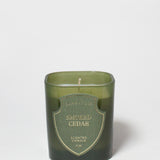 Smoked Cedar scented candle in a dark green glass vessel with a single wick.