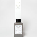 Topgana Canyon reed diffuser in a gray bottle with black cap and tall box packaging