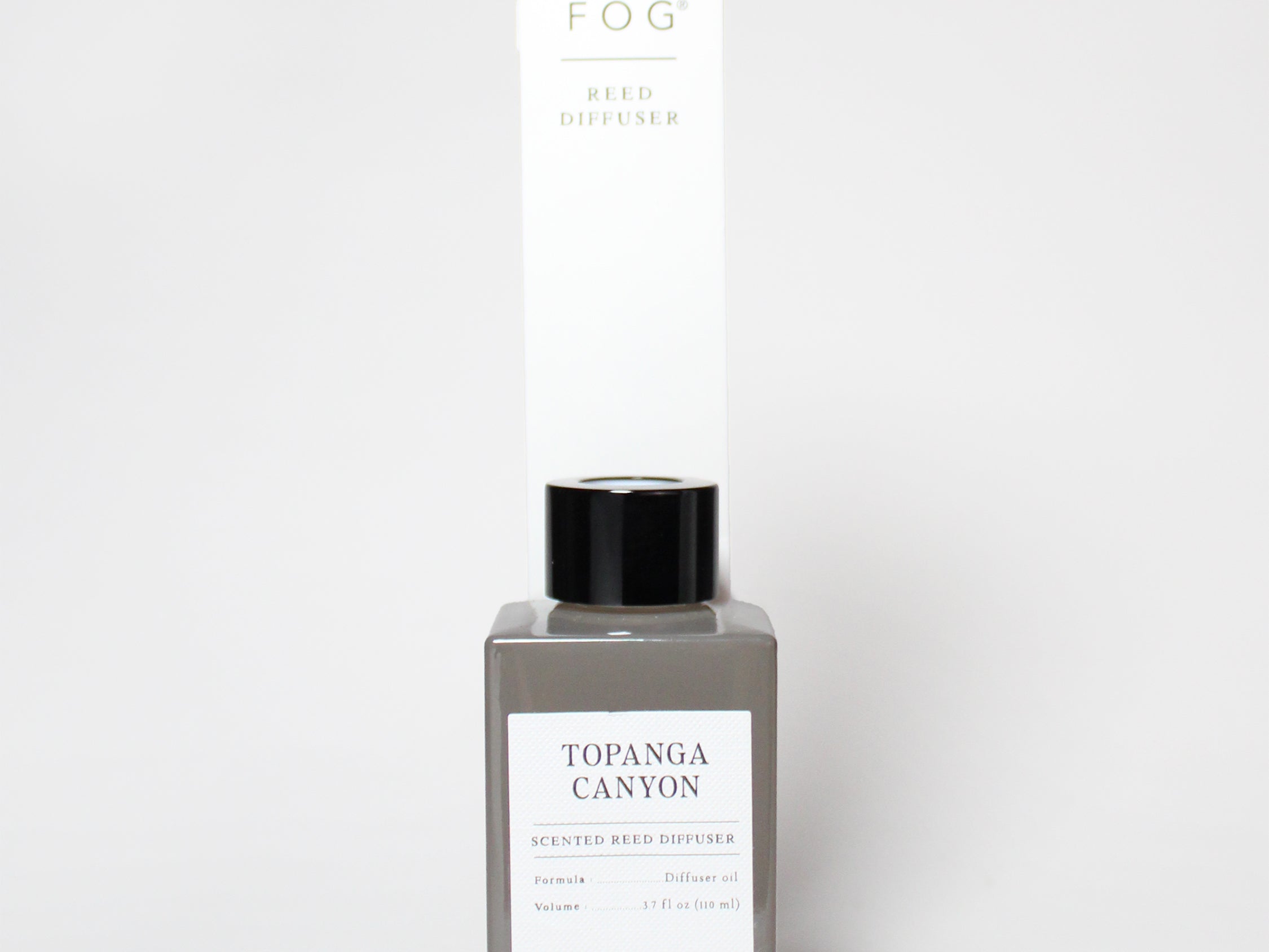 Topgana Canyon reed diffuser in a gray bottle with black cap and tall box packaging