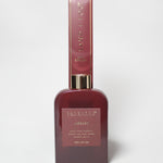 Burgundy 200 ml reed diffuser with gold-tone collar and matching box.