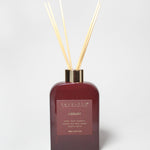 200 ml burgundy reed diffuser bottle with gold-tone collar and four natural reeds.
