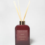 200 ml burgundy reed diffuser bottle with gold-tone collar and four natural reeds.