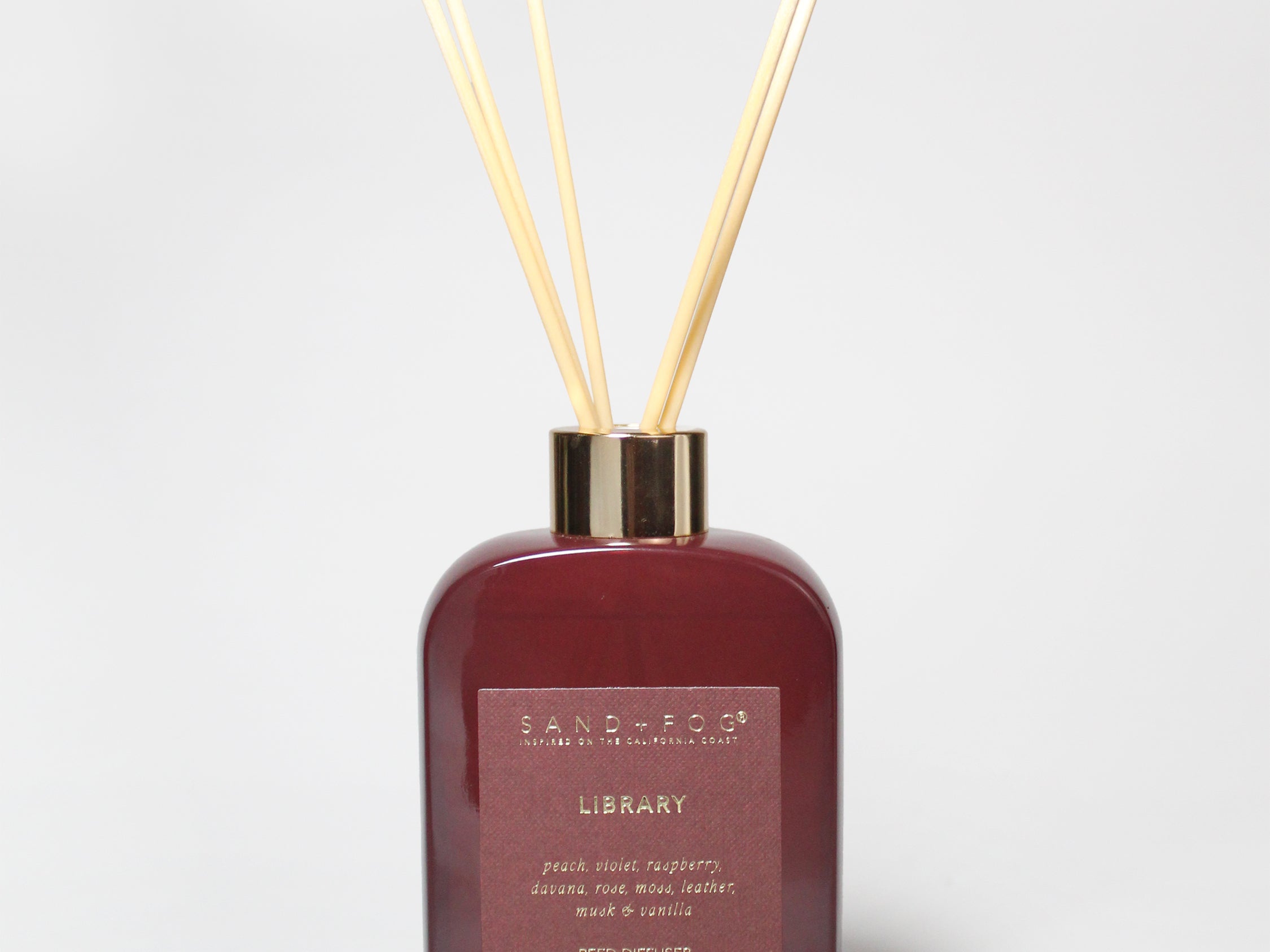 200 ml burgundy reed diffuser bottle with gold-tone collar and four natural reeds.