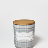 Salted Marshmallow scented candle in a gray plaid glass jar with a round wooden lid.
