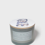 Sand + Paws Gardenia scented candle with dog-illustrated lid and front label