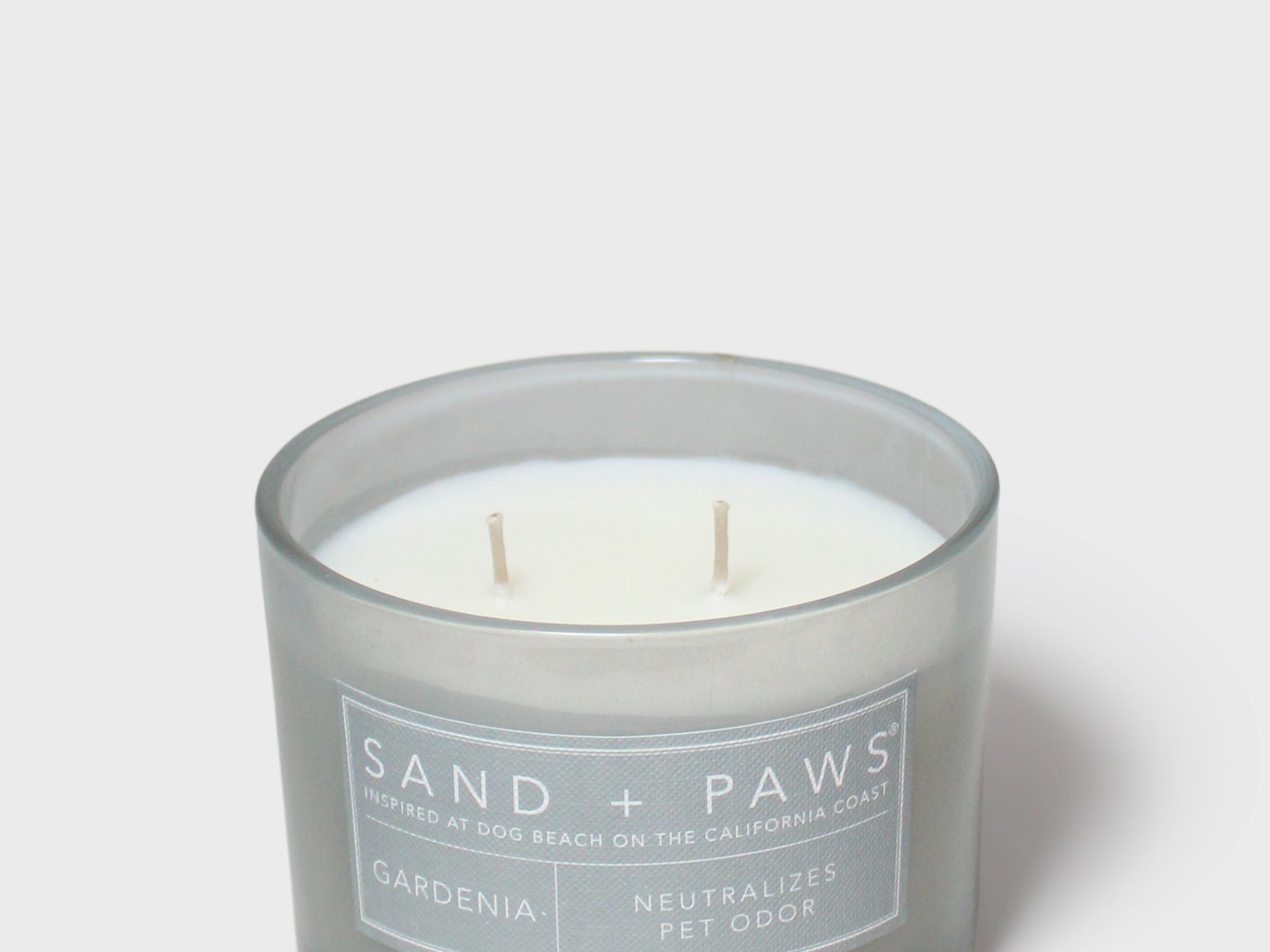 Sand + Paws Gardenia scented candle in blue glass jar, white wicks