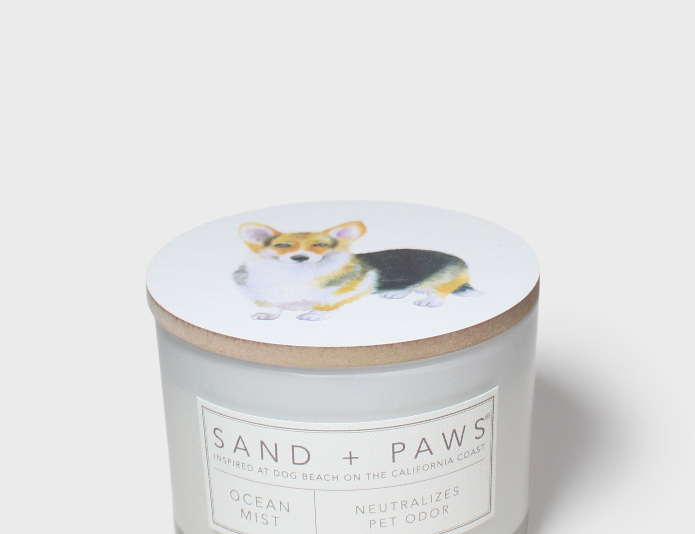 Scented candle with corgi graphic lid and Ocean Mist label