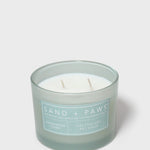 Scented candle in frosted light-blue jar with two wicks and label