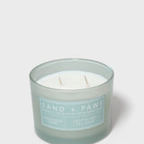 Scented candle in frosted light-blue jar with two wicks and label