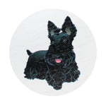 Scented candle lid with black dog illustration on light circle