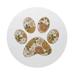White candle lid with multicolor paw print pattern.