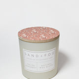 Scented candle tin with rose floral lid and front label