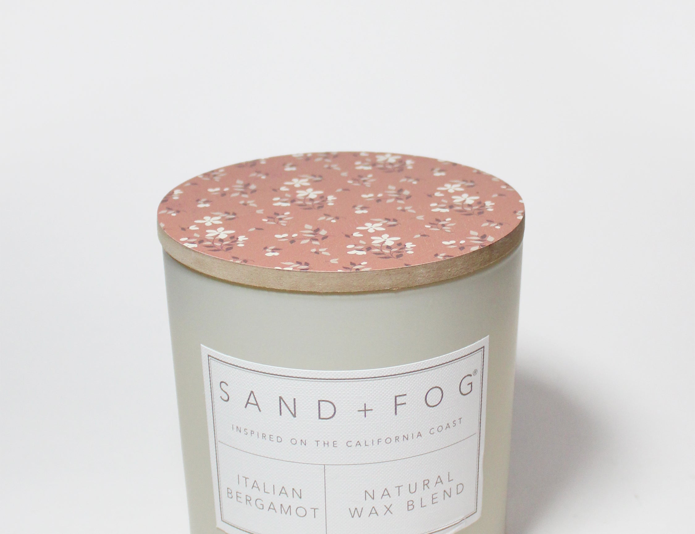 Scented candle tin with rose floral lid and front label