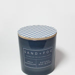 21 oz scented candle with blue chevron lid and dark blue glass jar label