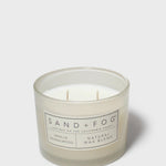SAND + FOG scented candle jar with two wicks and vanilla sandalwood label