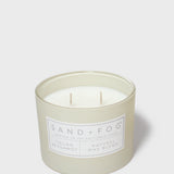 Scented candle in pale cream glass jar with two wicks and 'Bergamot' label