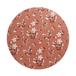 Scented candle lid with terracotta floral pattern, round wax candle top view