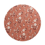 Scented candle lid with terracotta floral pattern, round wax candle top view
