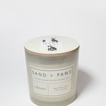 21 oz Sand + Paws Library scented candle jar with lid graphic and front label