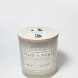 21 oz Sand + Paws Library scented candle jar with lid graphic and front label