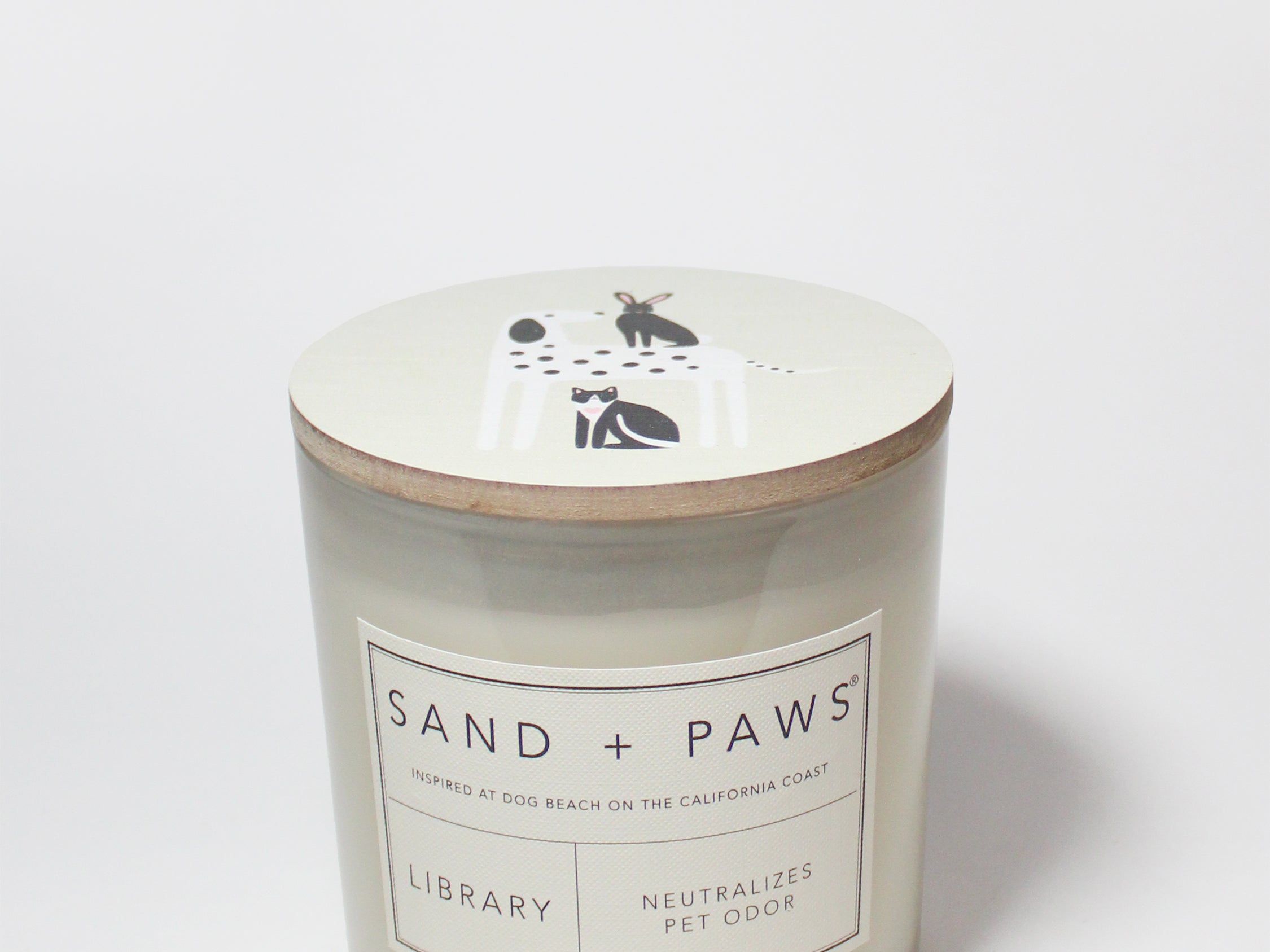 21 oz Sand + Paws Library scented candle jar with lid graphic and front label