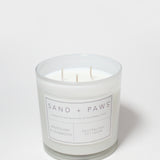 Glass scented candle with Sand + Paws label, Mahogany & Teakwood, and three wicks