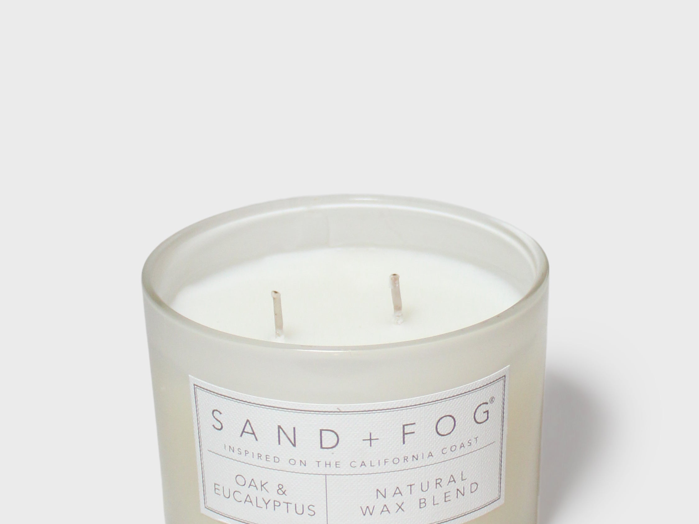 SAND + FOG scented candle jar with two wicks and label, natural wax blend